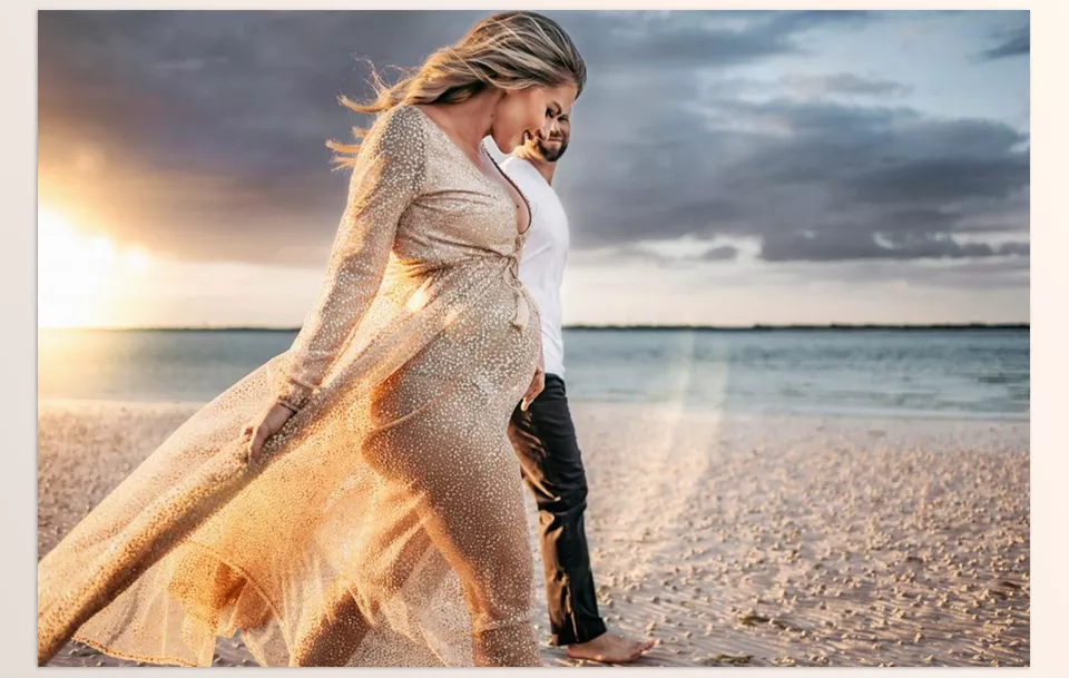 Meridian Presets - Lens Flare V1 - Golden hour light dances across their faces as they pause in a quiet field, wrapped in each other’s warmth.